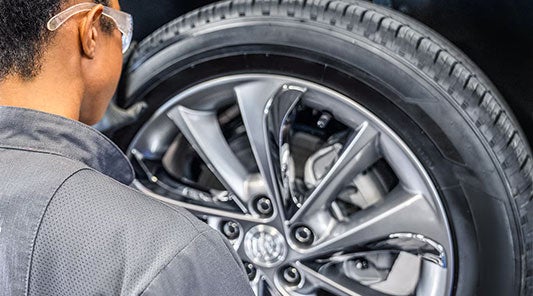 A men is fitting a tire